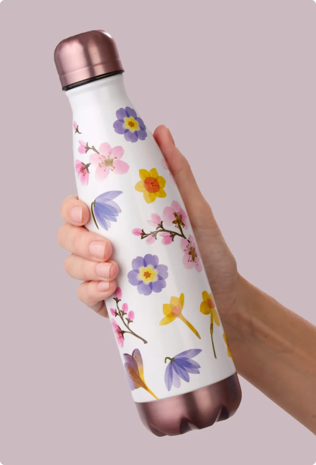 Reusable water bottle with watercolor floral surface design and rose-gold accents